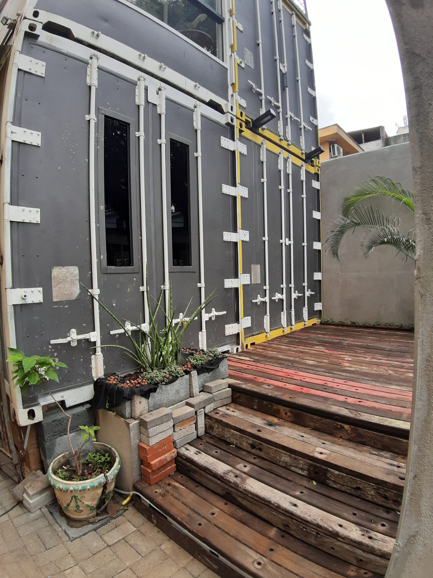 Container shells with their original steel doors during the build